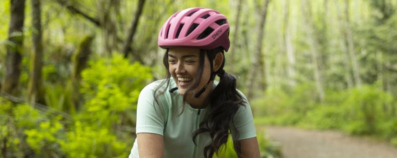 Women wearing a pink bike helmet
