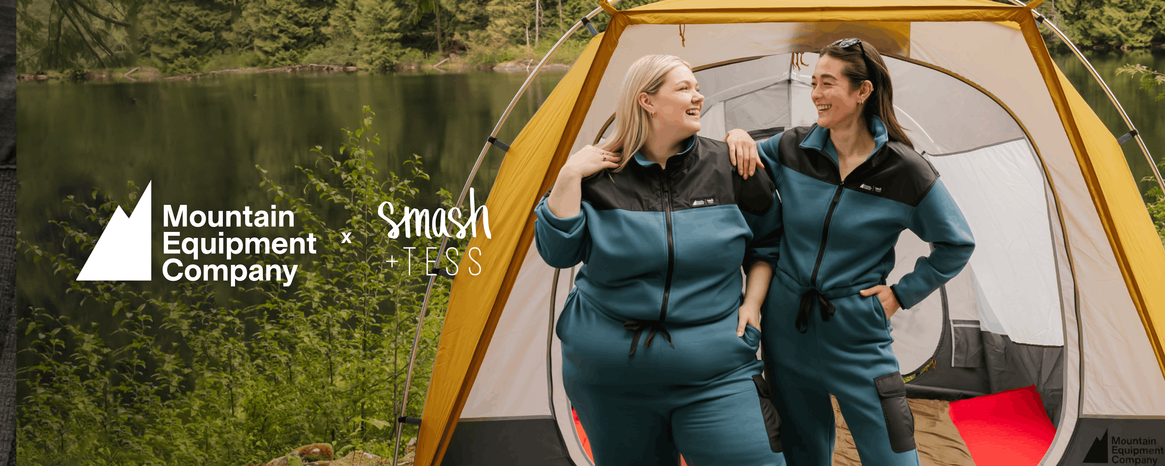 Two people wearing the Smash + Tess x MEC Fresh Air Fleece Jumpsuit, smiling and standing in front of a tent
