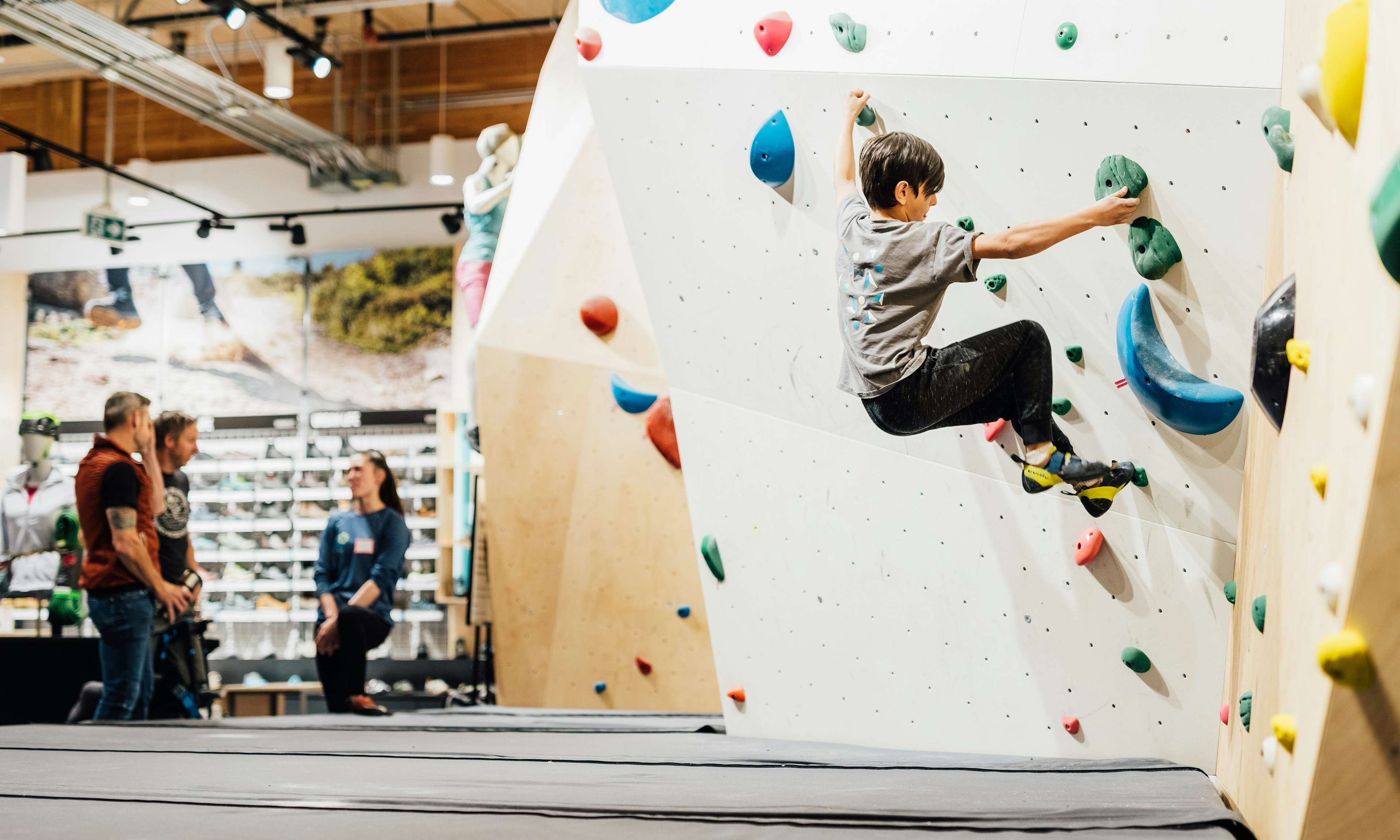 Young climber bouldering at the MEC Vancouver store