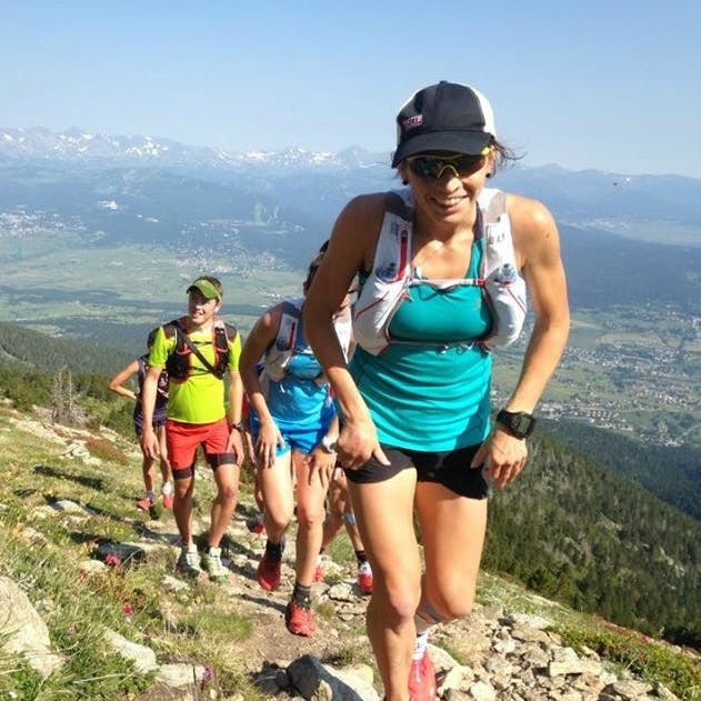 Ellie Greenwood racing with mountain backdrop