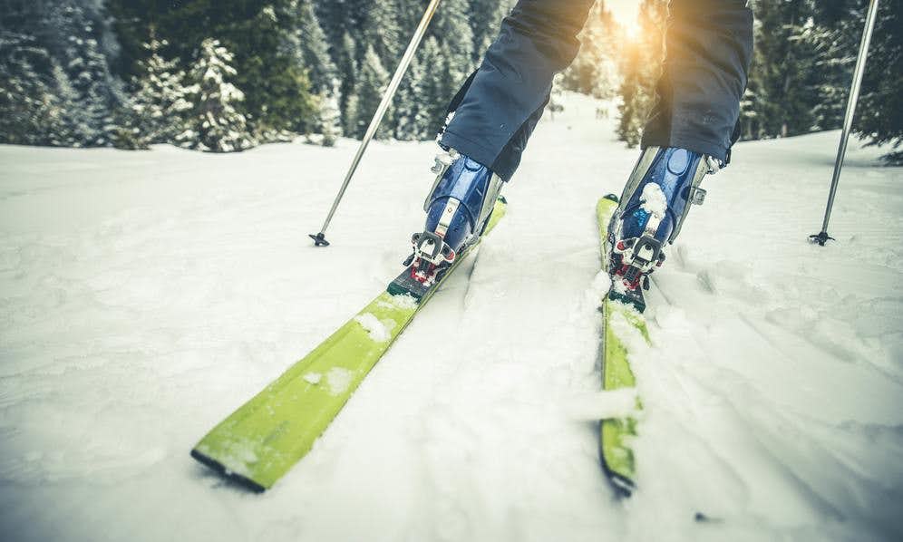 Close-up of skis and boots in snow