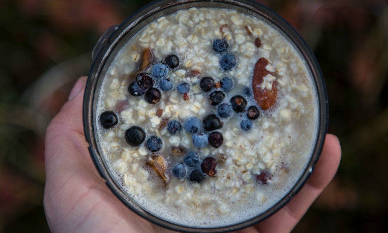 Fresh blueberries snazz up oatmeal on Ben Haggar’s bikepacking expedition in Greenland, supported by MEC. Photo: Ben Haggar.