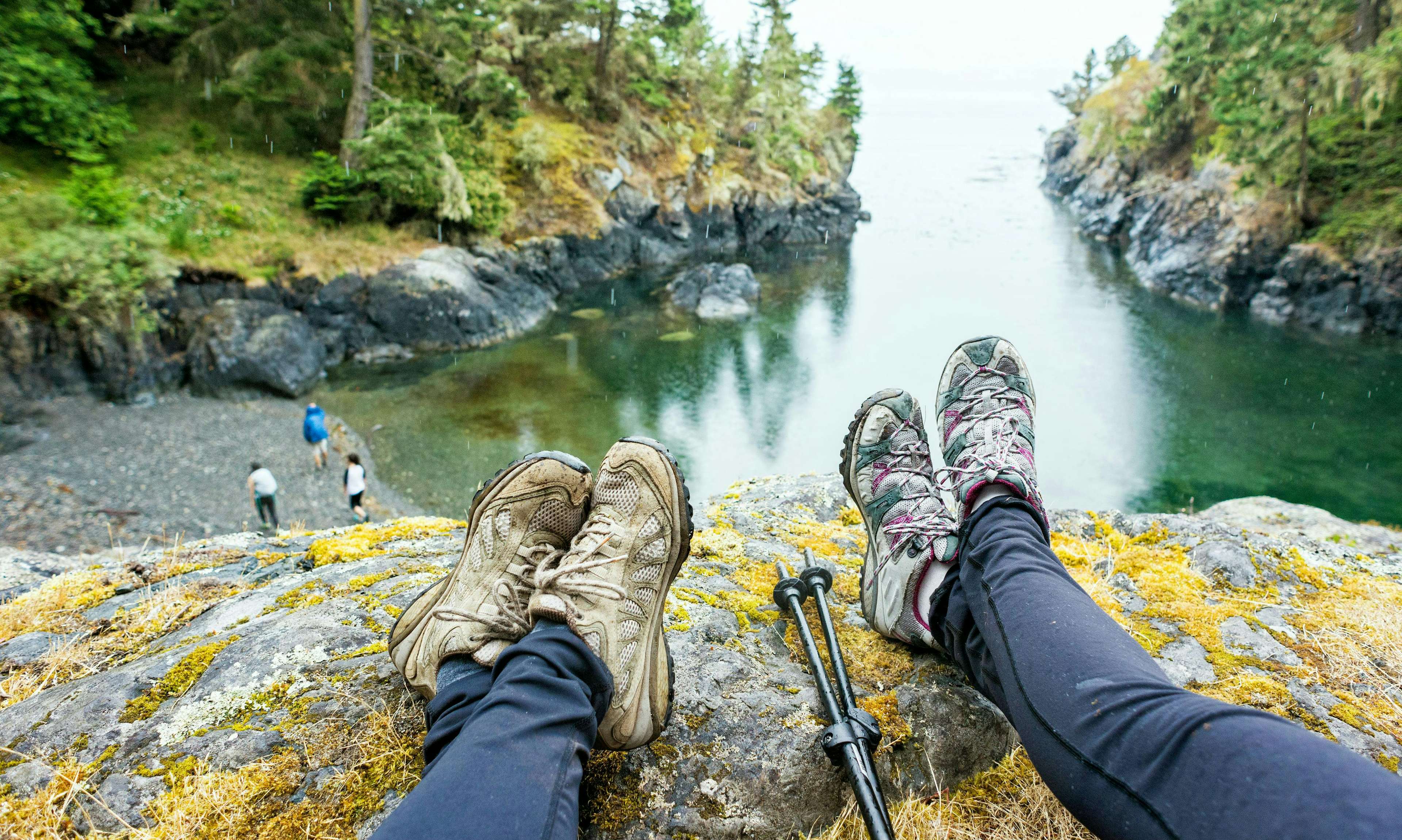 Hiking boots near the edge of a cliff