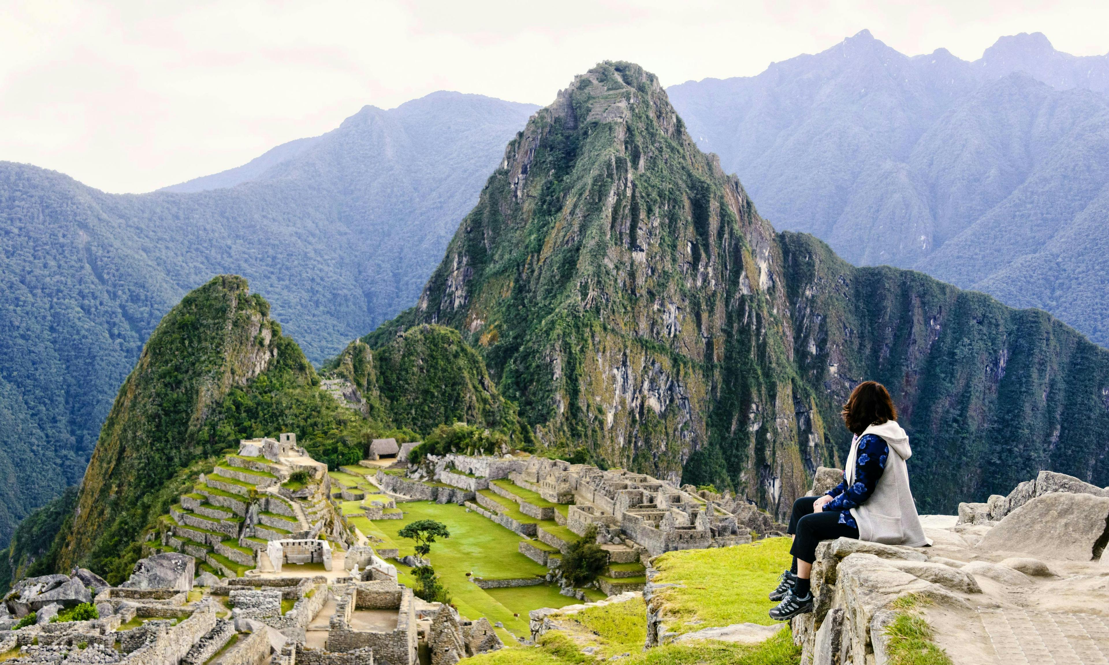 Hiker sitting at the view at Machu Picchu