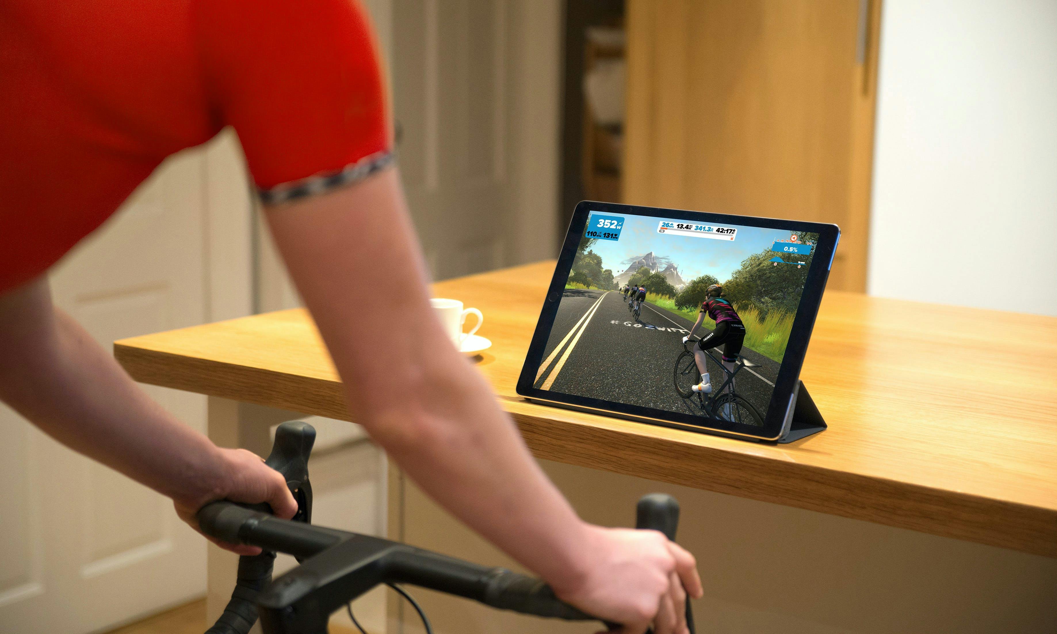 Person riding indoor trainer with Zwift