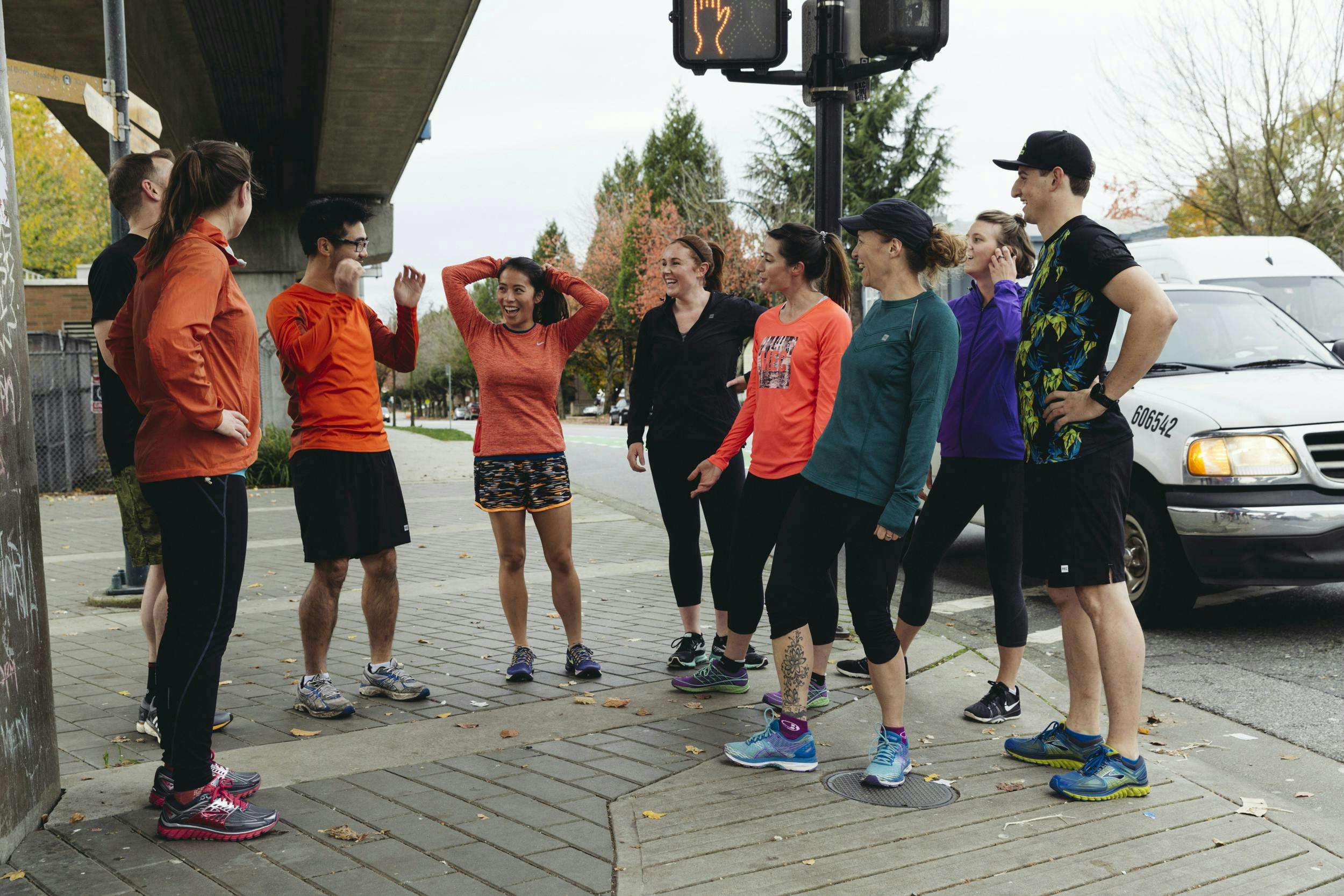 Crew of runners waiting at an intersection