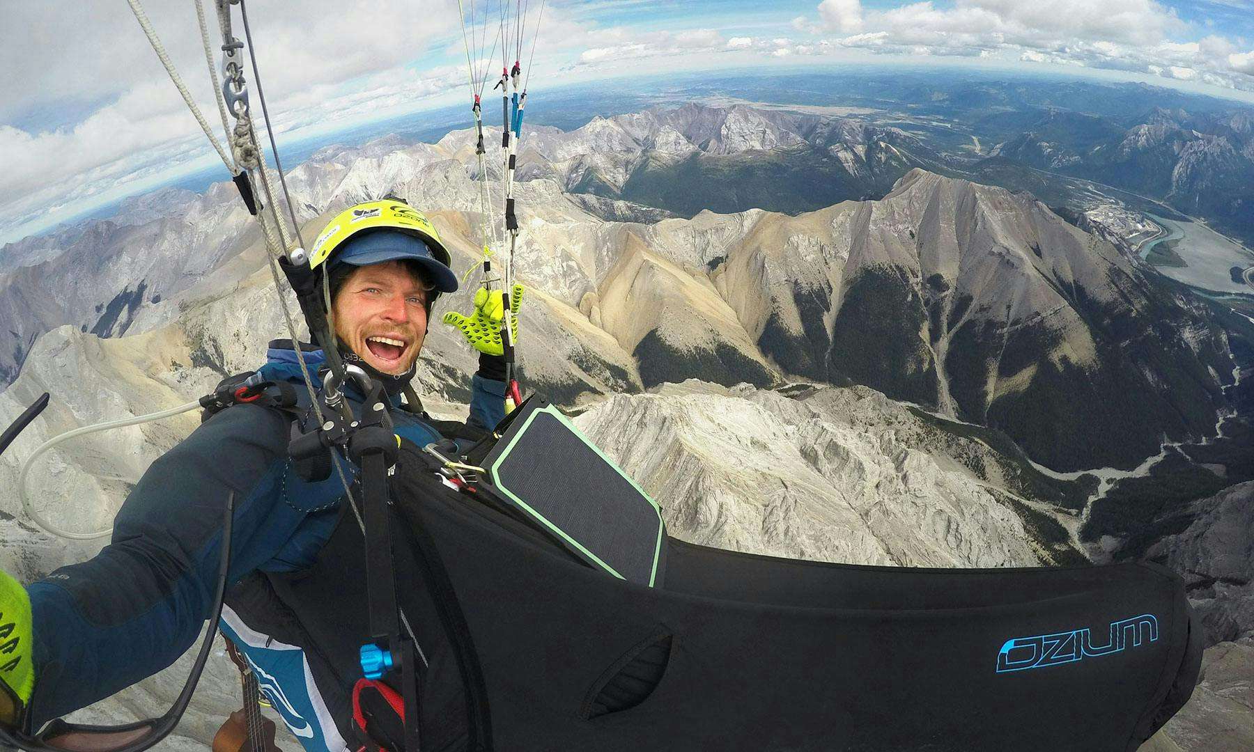 Benjamin Jordan paragliding above Lady MacDonald mountain
