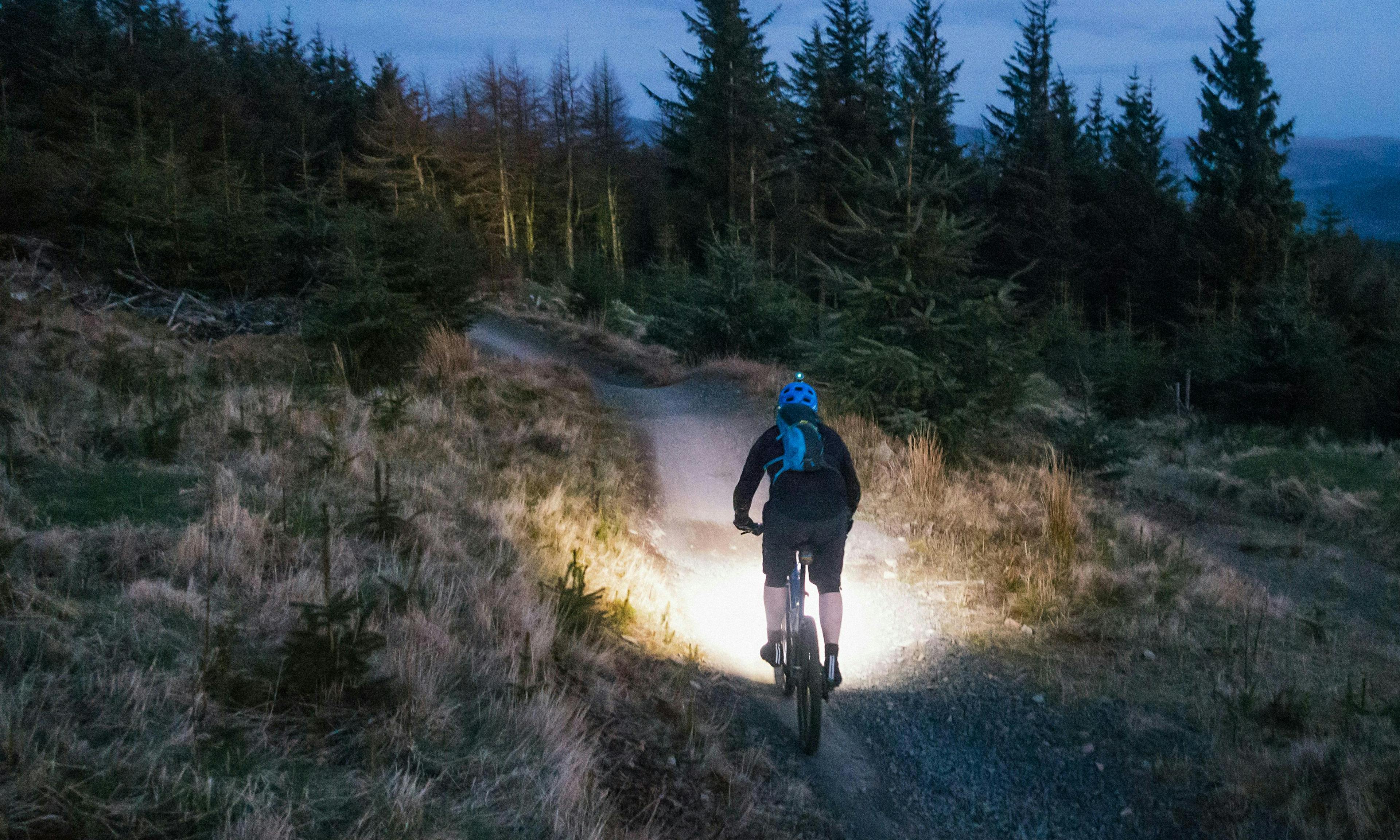 Mountain biking at night with headlamp