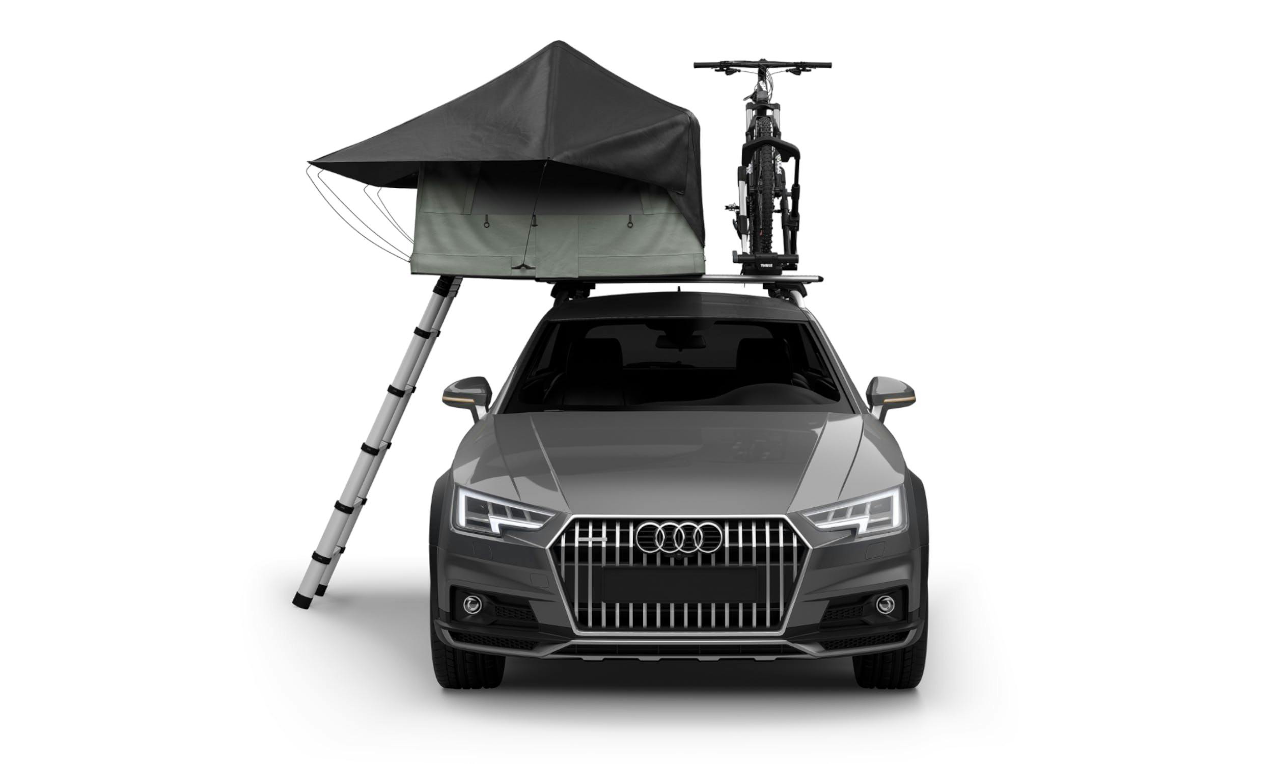 Thule Foothill tent shown set up on the top of a car, with a bike also on the roof rack