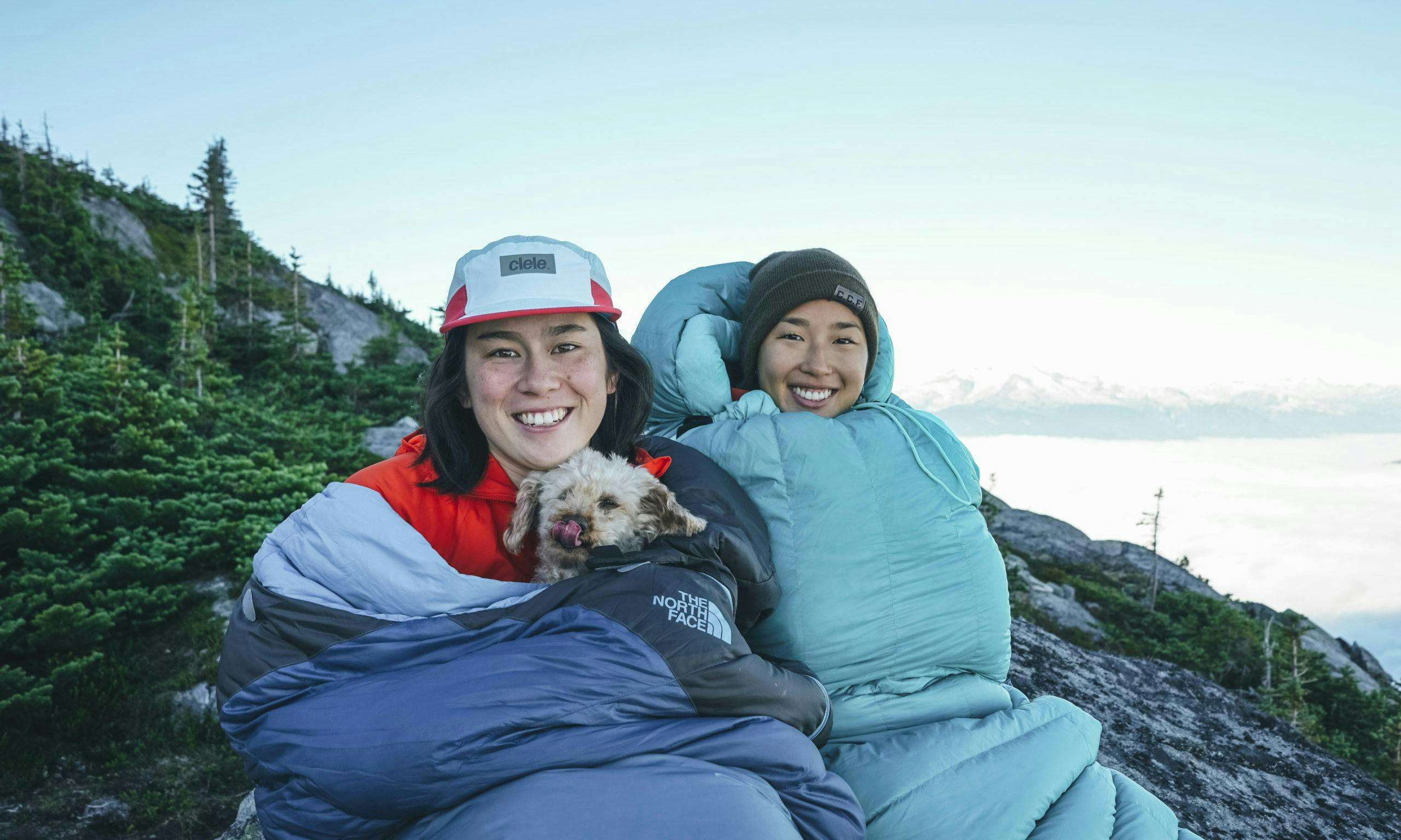 Yuki and friend in sleeping bags in the backcountry