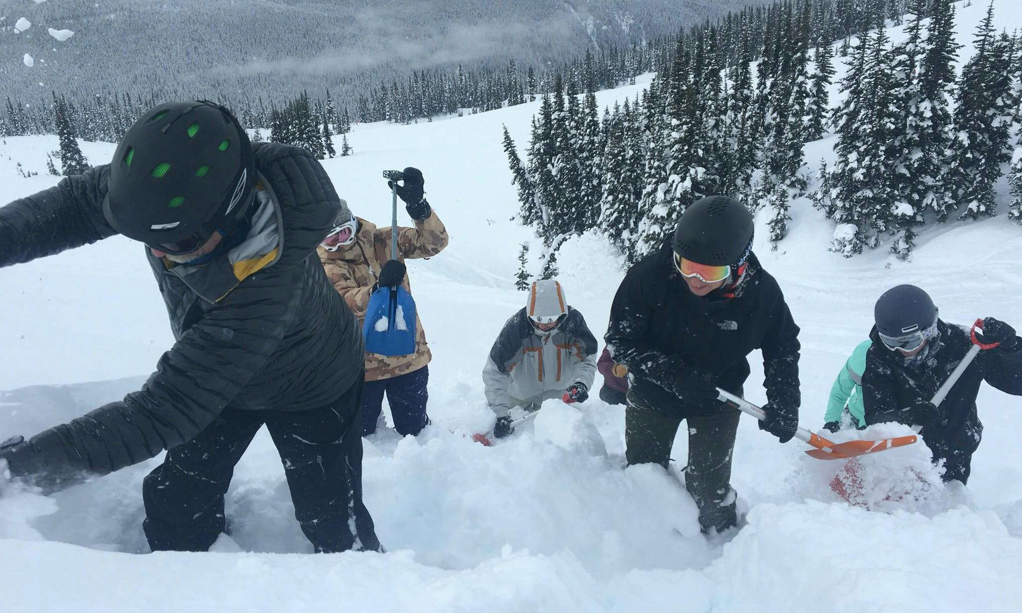 Proper shovelling technique as a group is just one of the skills you learn in training.
