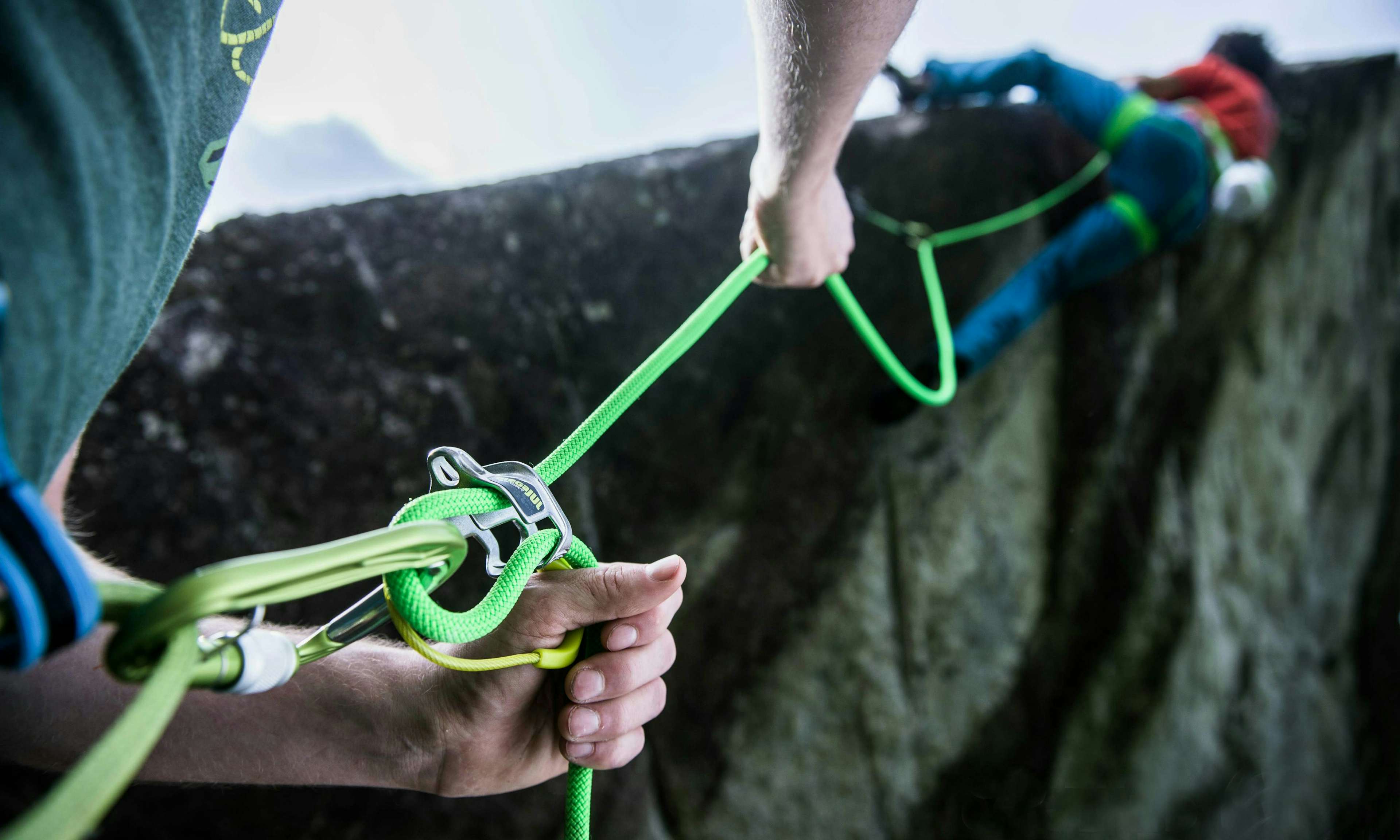 Close-up view of a belayer belaying