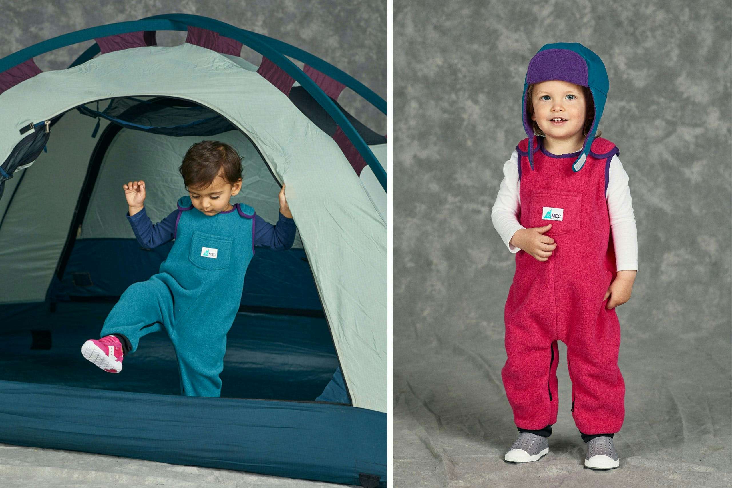 Two young kids wearing fleece overalls in a photo studio; the overalls are teal and pink
