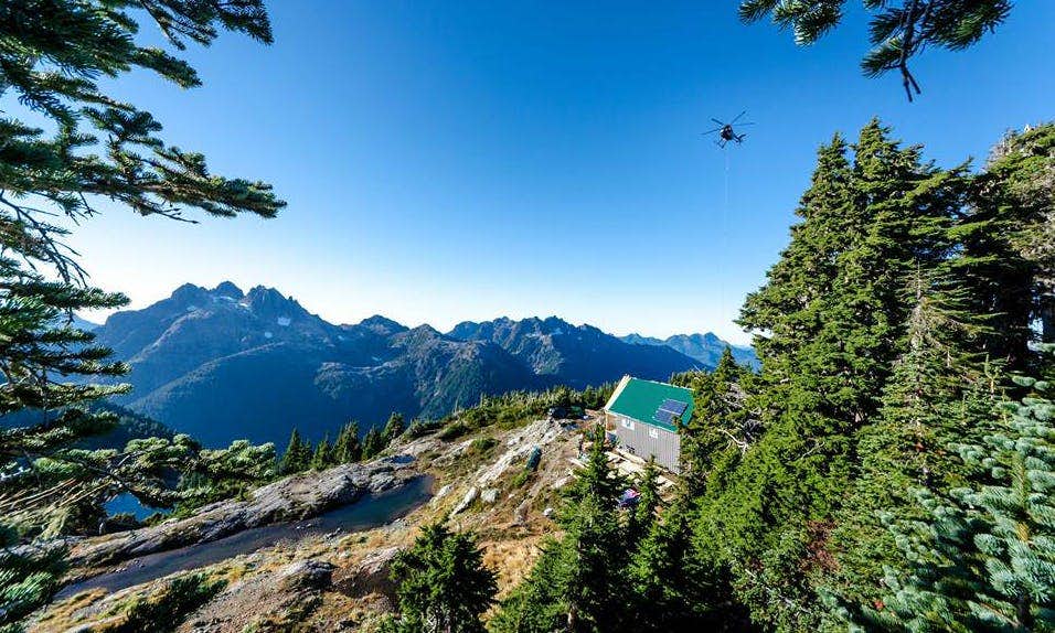 Helicopter flying out gear for Alpine Club of Canada hut construction on Vancouver Island