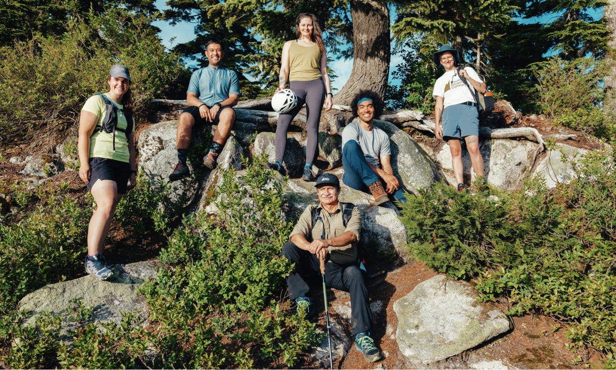 Group of 6 people outside who stopped for a photo while hiking
